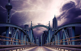 Three seperate lightning bolts captured above the bridge on a stormy day